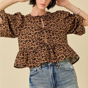 Olivaceous brand leopard print top with puff sleeves and a ruffled hem